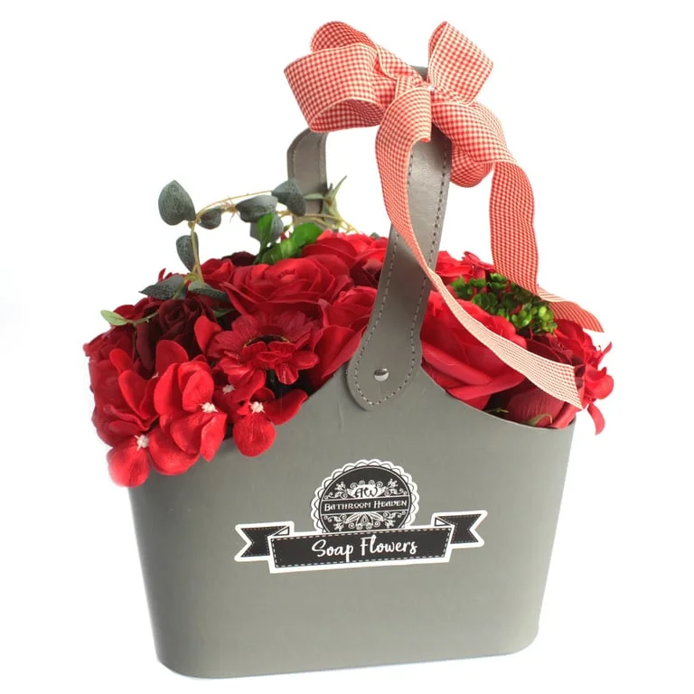 Red soap flower bouquet displayed in a natural twine basket