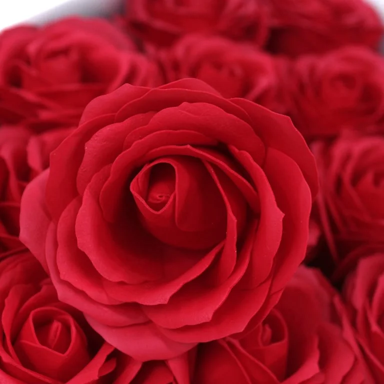 Large red soap flower made from soap, shaped like a rose with soft petals.