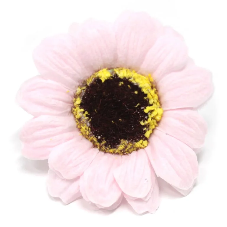 Small pink soap flower shaped like a sunflower, delicate craft soap bloom.