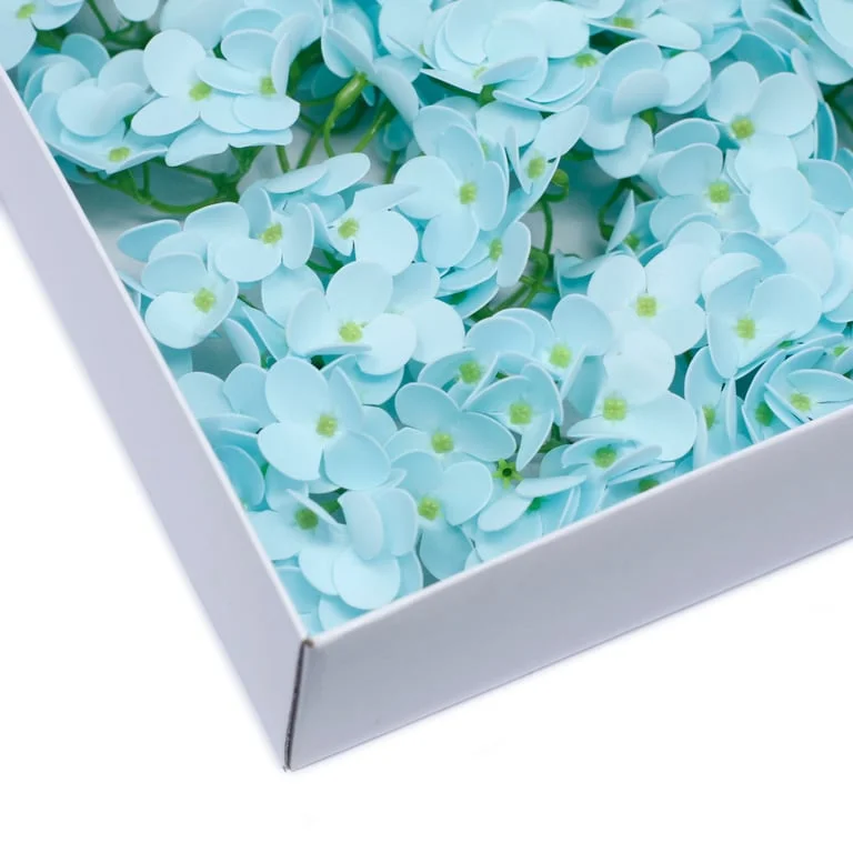 Baby blue craft soap flower styled like a hyacinth bean design.