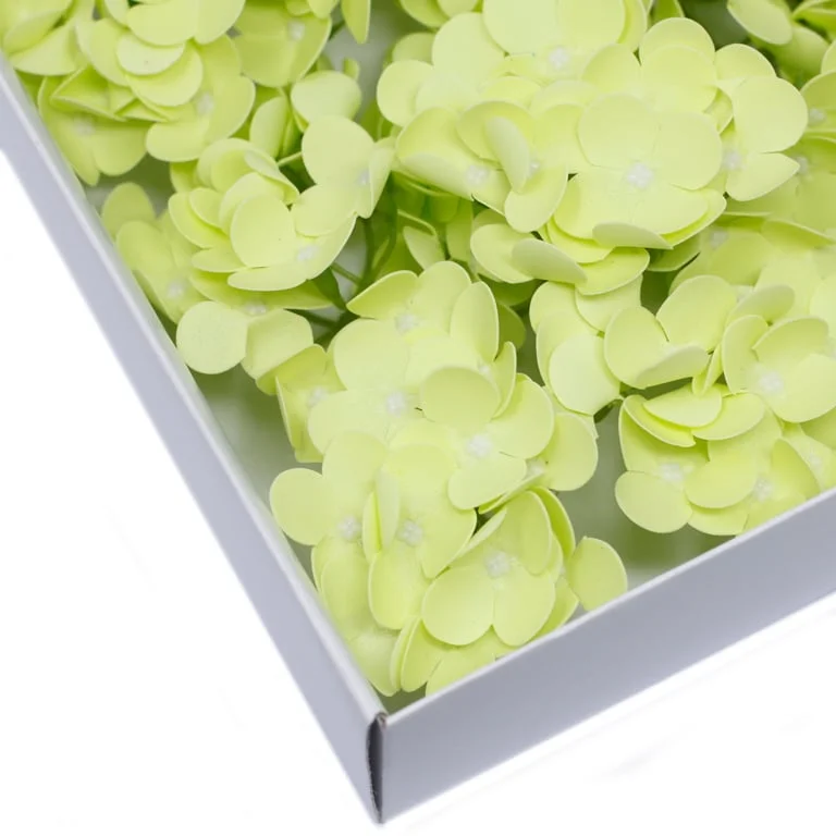 Craft soap flowers in hyacinth bean shape, soft spring green hue.