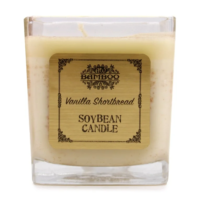 Soybean jar candle, vanilla shortbread candle, dark glass jar with visible wick.