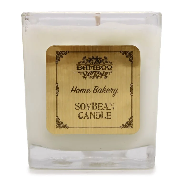 Soy candle jar in clear glass with a wick, labelled Home Bakery.