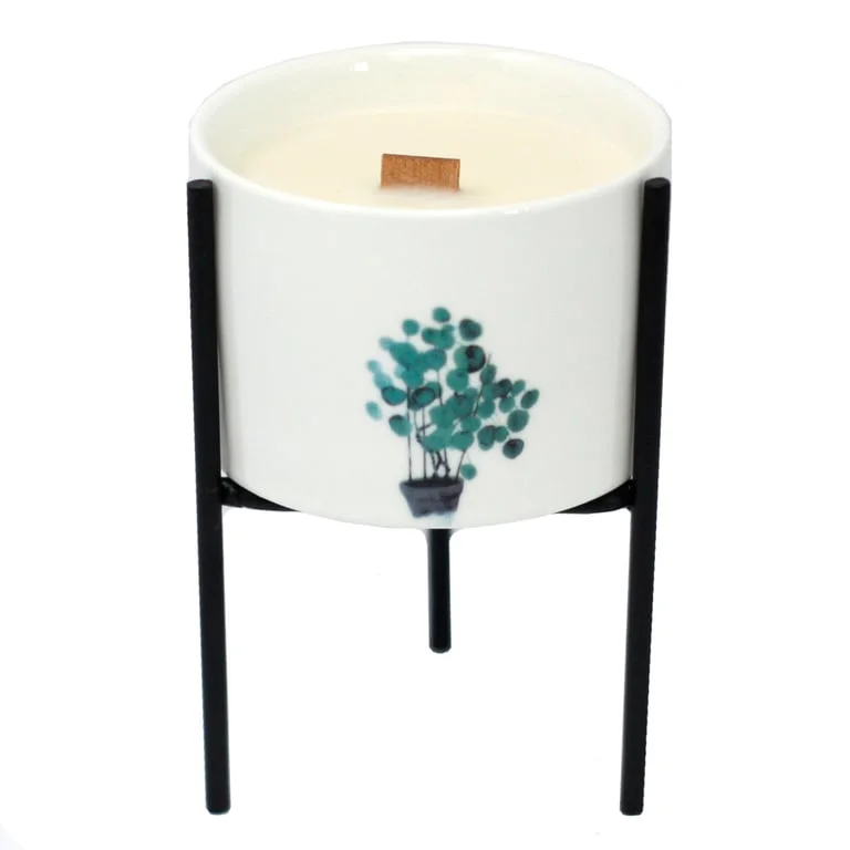 Iron botanical candle holder featuring ornate metal plant designs