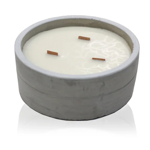 Large round orange scented candle with crushed vanilla and orange design on a plain white background.