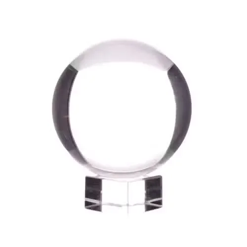 Decorative crystal ball on a polished stand, 50 mm in diameter.