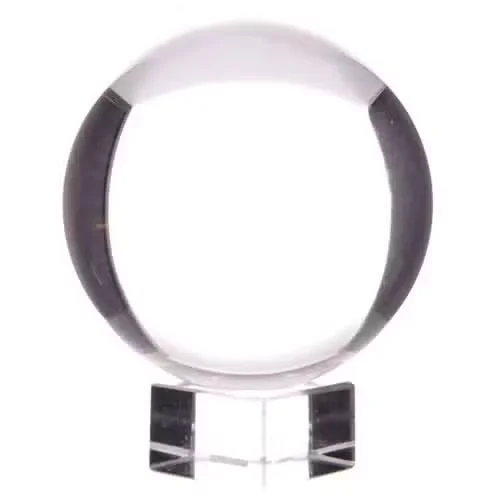 Glass crystal ball sitting on a minimalist stand, 150mm in diameter.