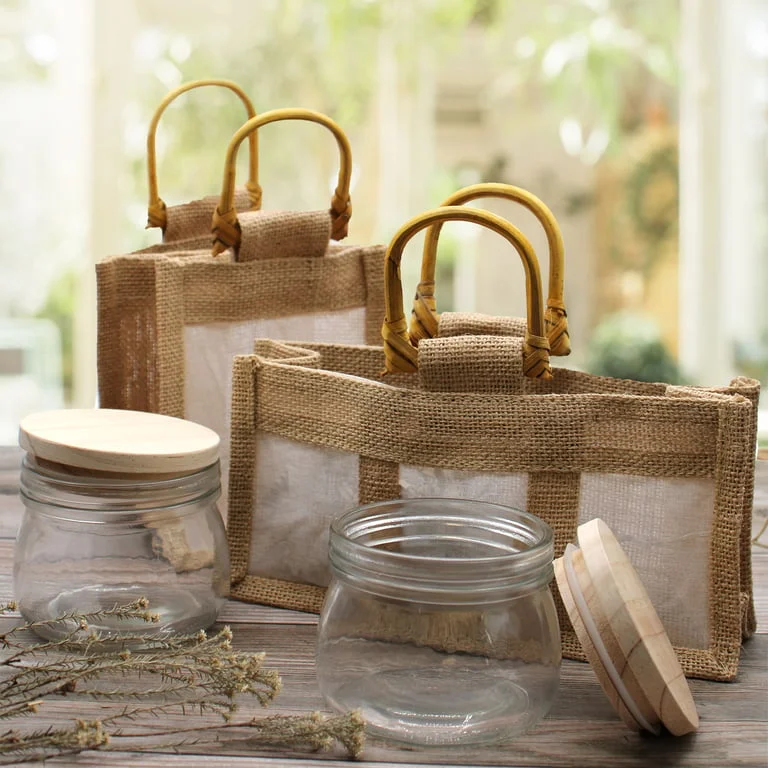 small storage jar with a clear window, packaged in a matching gift bag
