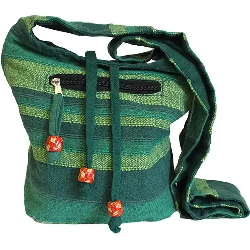 Forest green Nepal sling bag with single strap, slung across the chest. Stylish and practical.