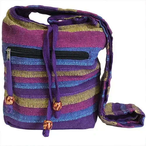 nepal sling bag featuring a vibrant wild flower design on its front panel and a single strap across the chest.
