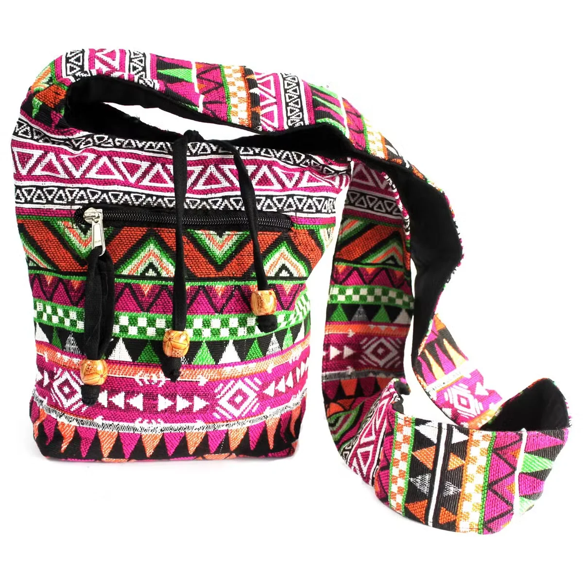 Stylish pink sling bag with jacquard design, strap slackly draped across a shoulder