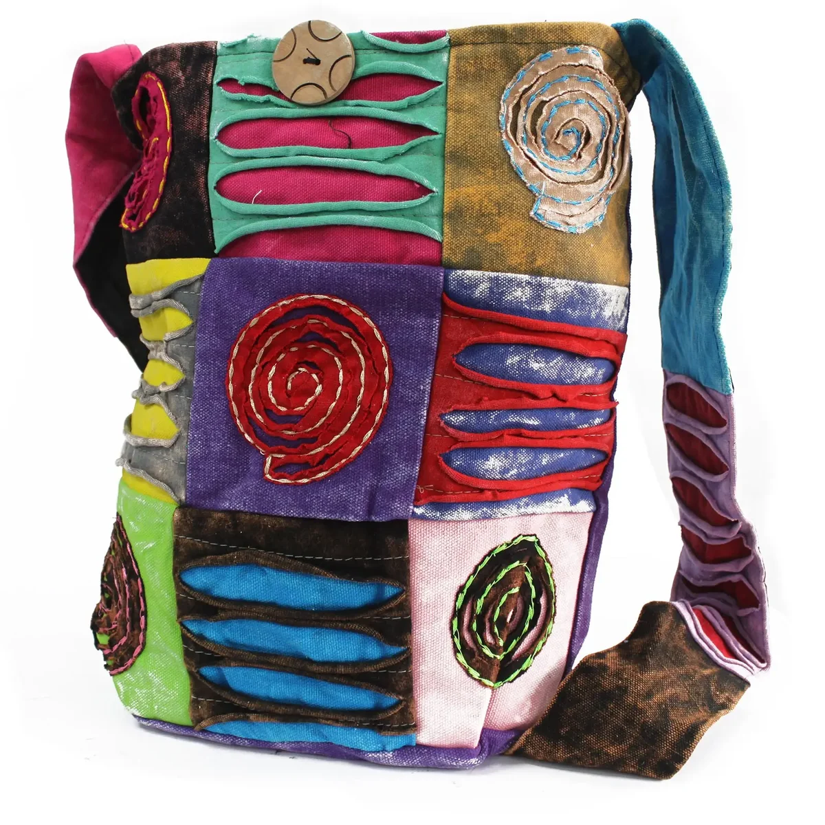 Ethnic sling bag in purple with spiral pattern, worn on shoulder.
