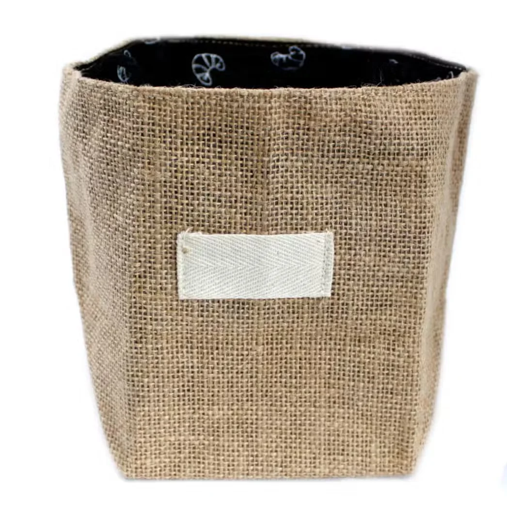 Large eco friendly bag made of natural jute and cotton, featuring a black lining.