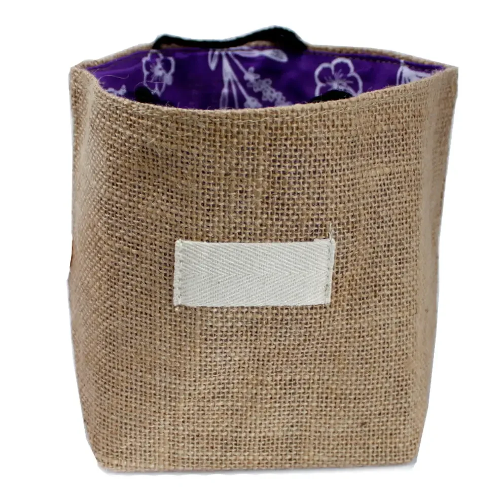 Large natural jute bag with lavender lining, shown open, displaying folded cotton lining and cotton handles