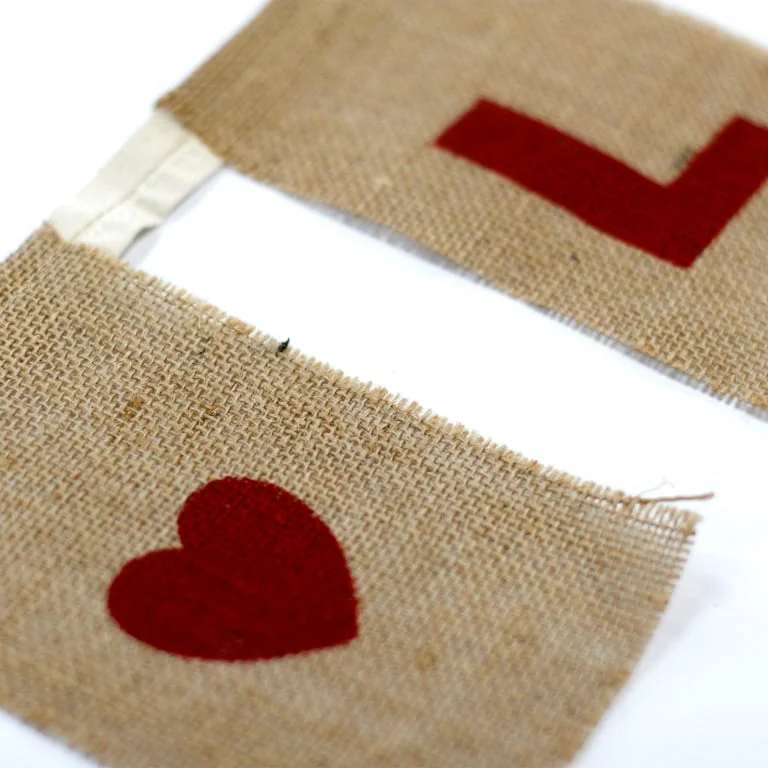Large love bunting featuring I LOVE YOU text and heart shapes in natural colours.