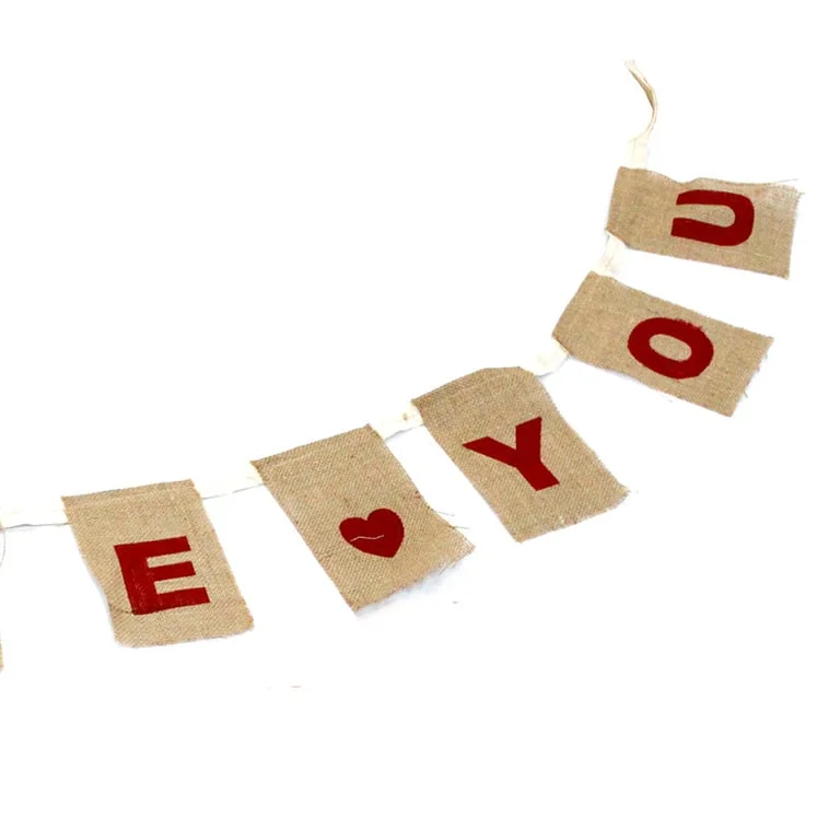 Large natural I LOVE YOU bunting featuring white text and hearts.