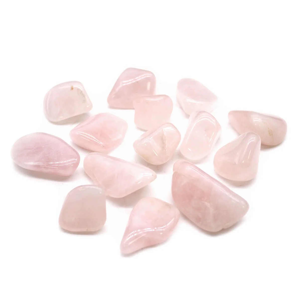 Rose quartz tumble stone from L Tumble Stones, showing a smooth translucent stone, light pink hue among glass‑like beads.