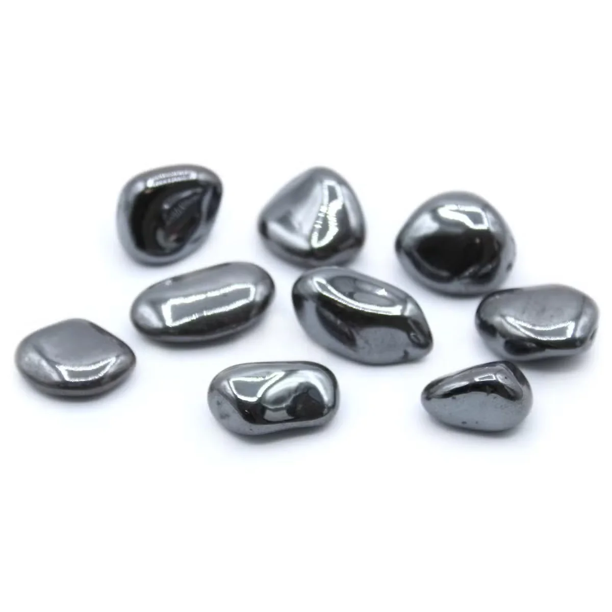 Hematite tumble stones arranged in a simple stack, showcasing healing crystal stones.