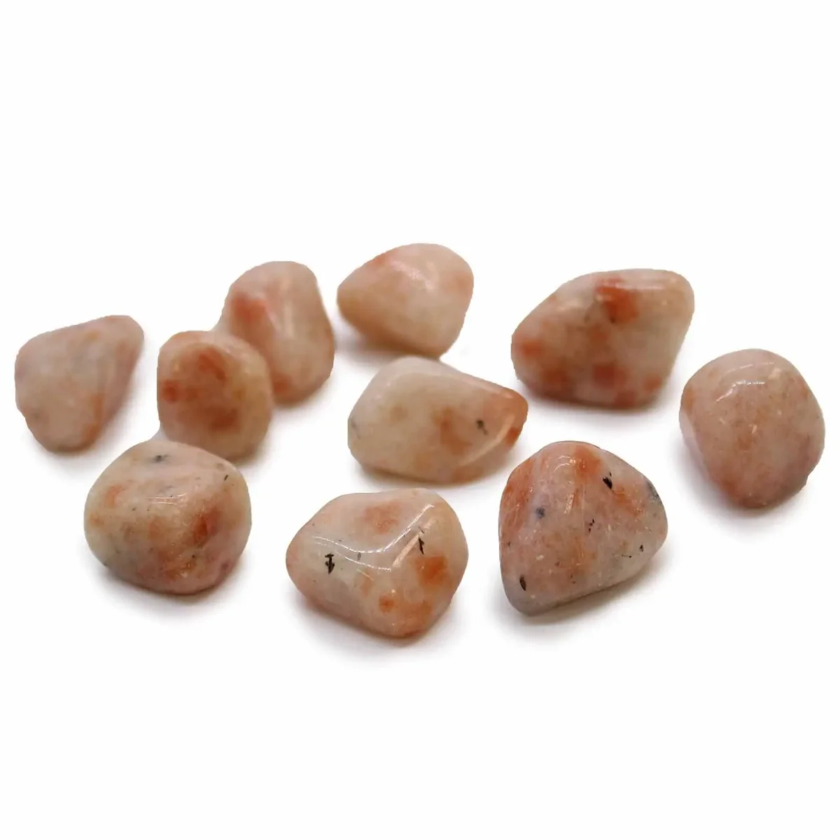 Sunstone natural tumble stone: smooth, polished surface with warm hazel hue, caught in natural lighting.