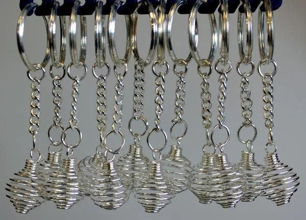 Spiral cage keyrings – 12 metal loops with key holders neatly arranged.