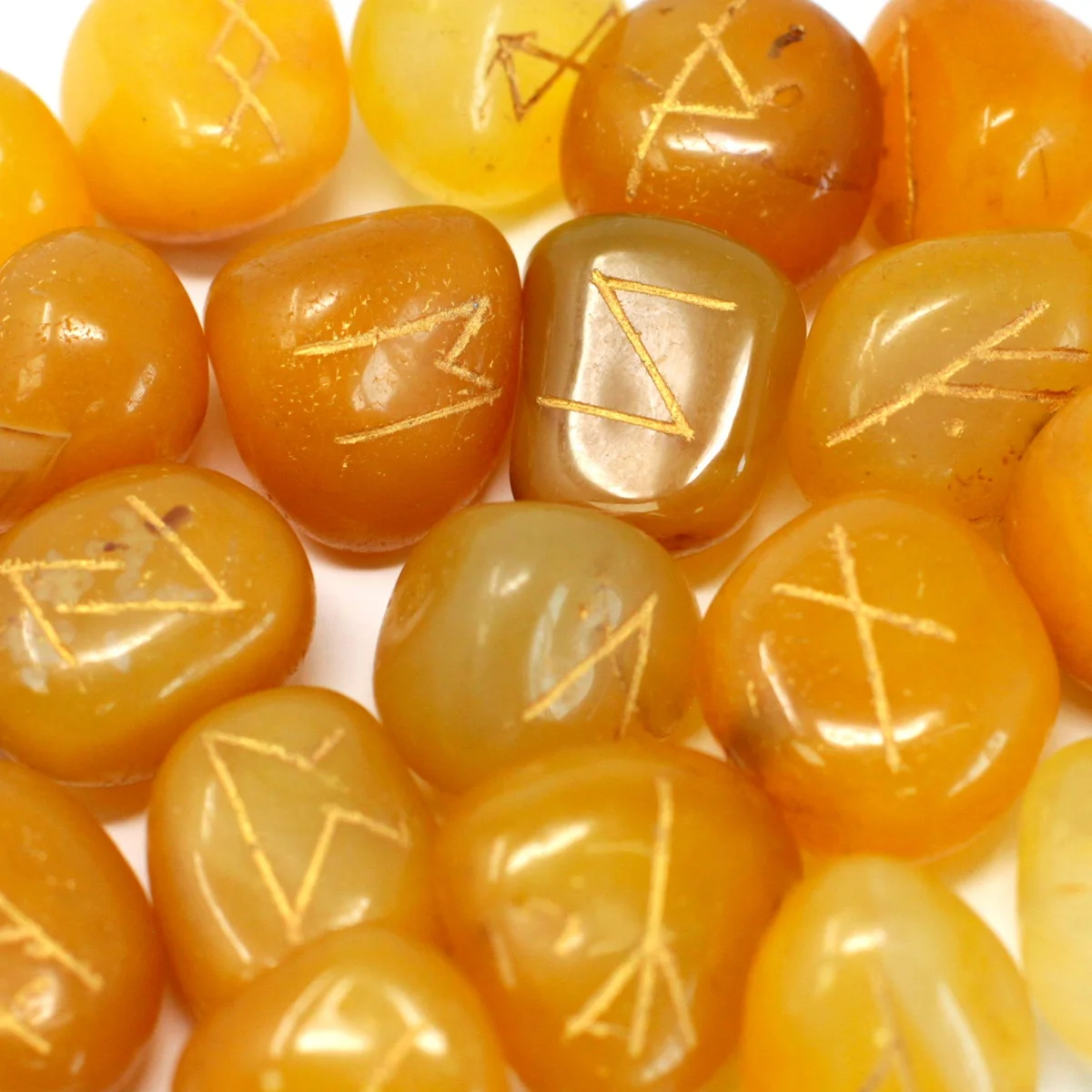 Yellow onyx rune stones pouch showing a set of smooth stones ready to be worn.