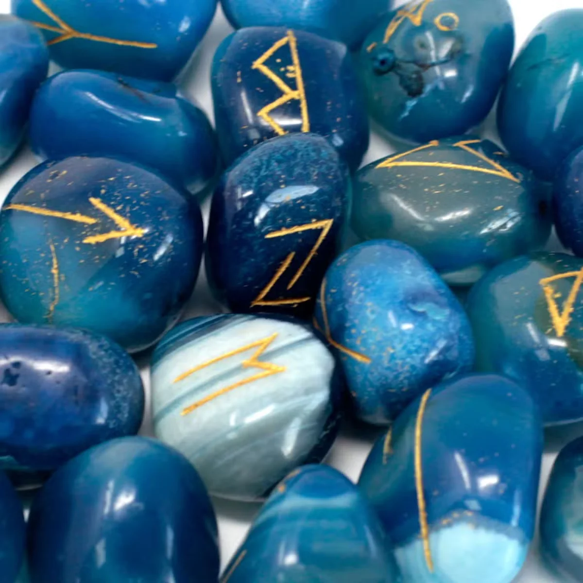 Blue onyx rune stones displayed inside a rune stones pouch.