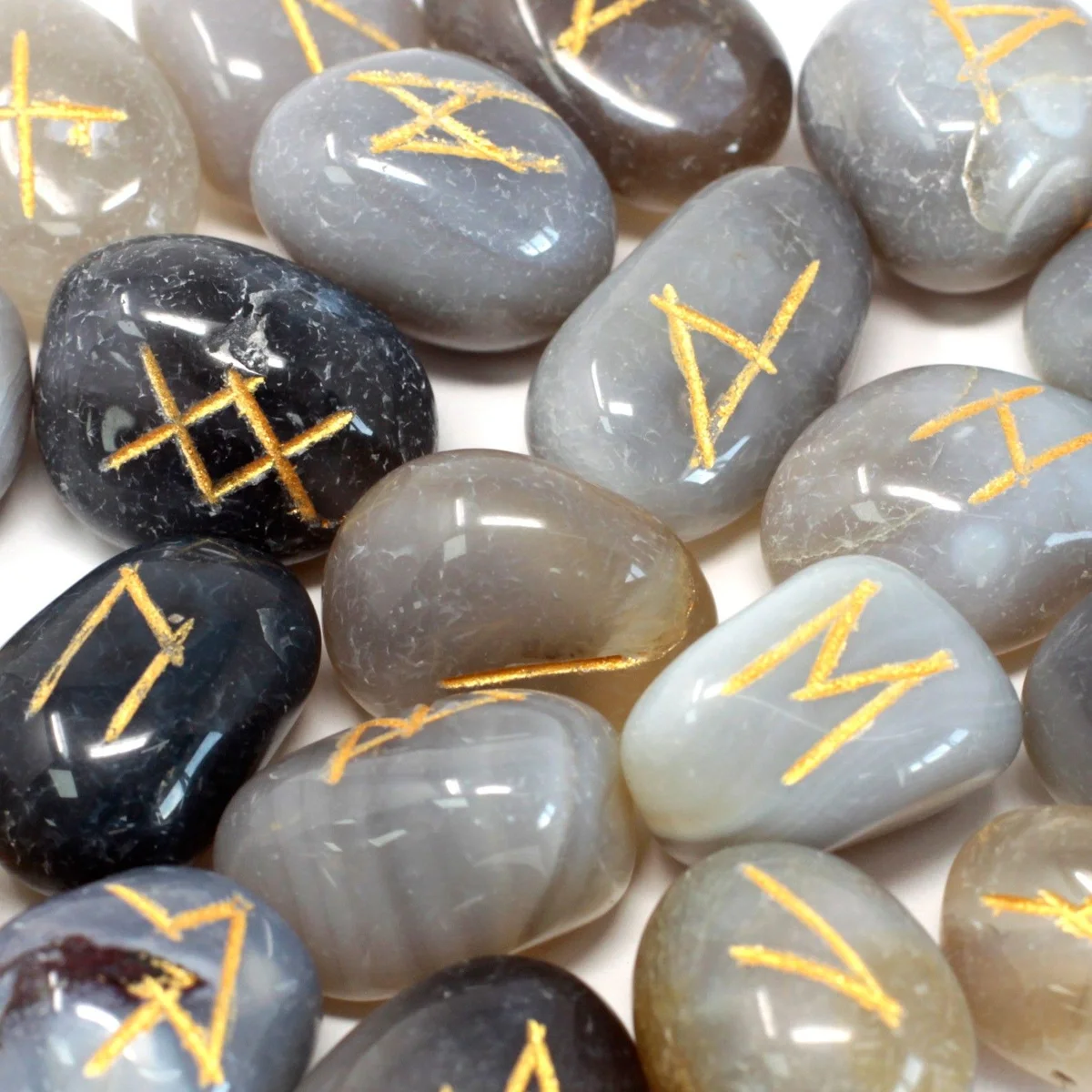 Grey agate rune stones neatly arranged in a small pouch.
