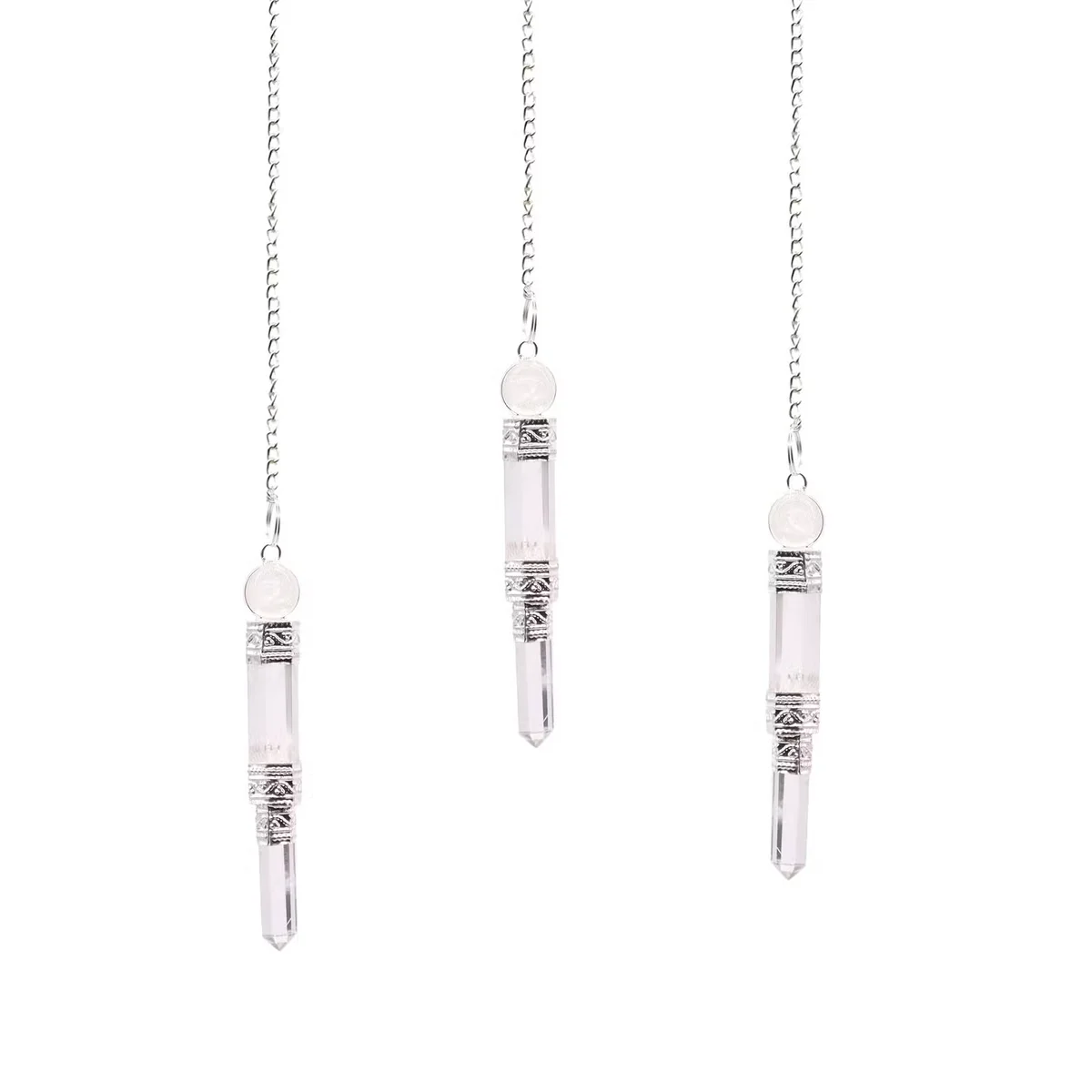 Crystal pendulum gift with a rock quartz sphere, suspended on a clear string.