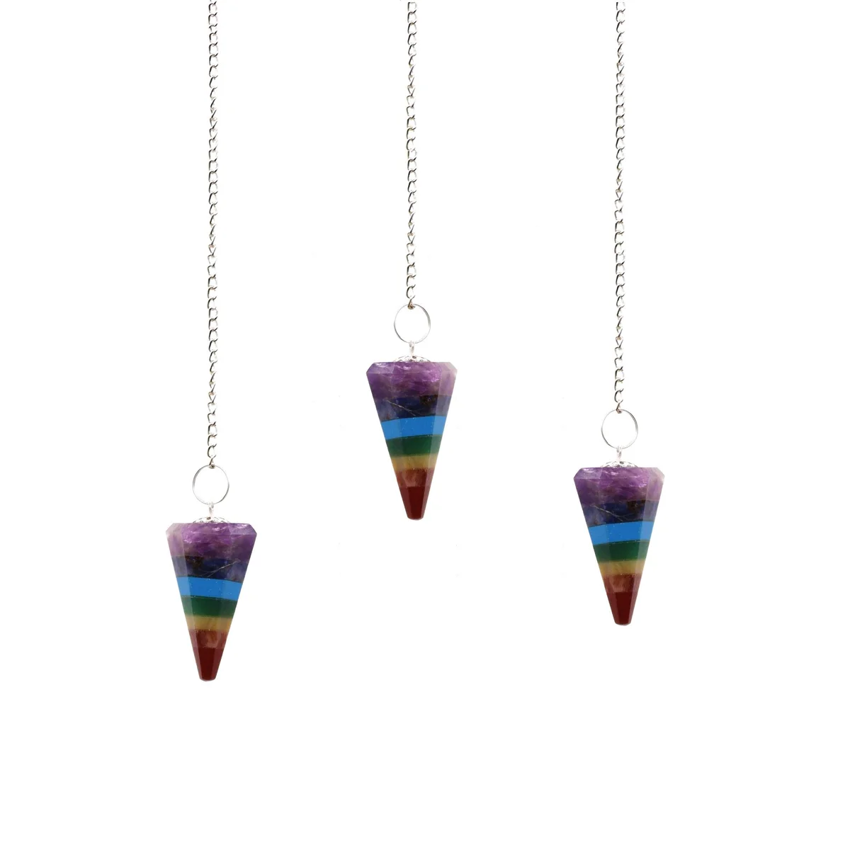 Seven chakra pendulums shown arranged on a flat background, each with layered sections