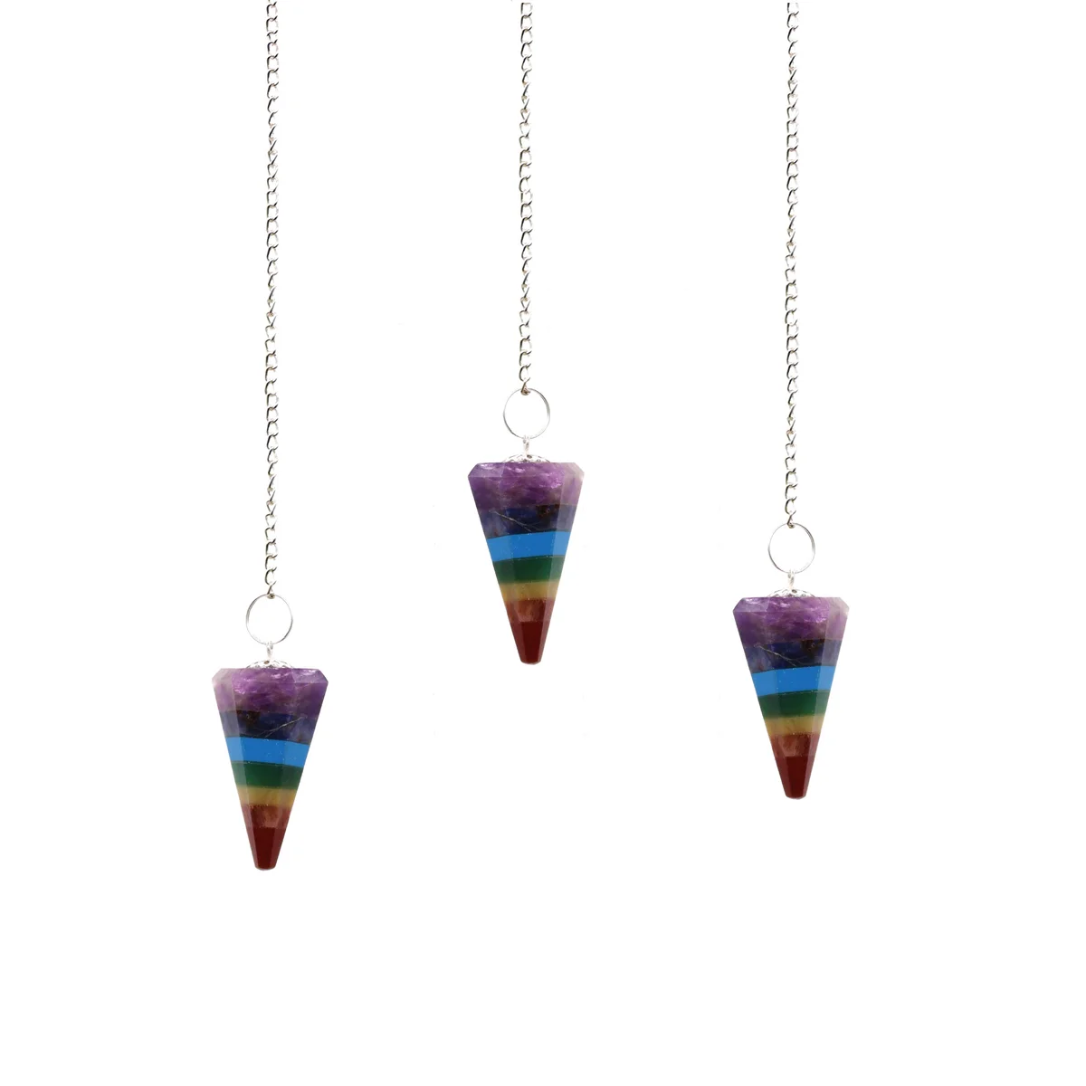 Chakra style 7 slice pendulums set – colorful spiritual pendulums displayed as a stylish decorative piece.