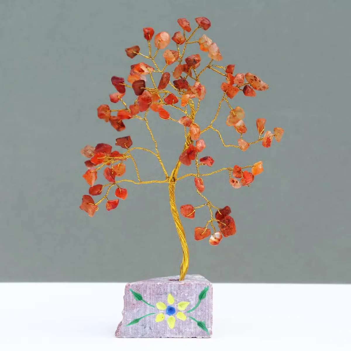 Carnelian figurine with smooth stone surface and subtle carvings.