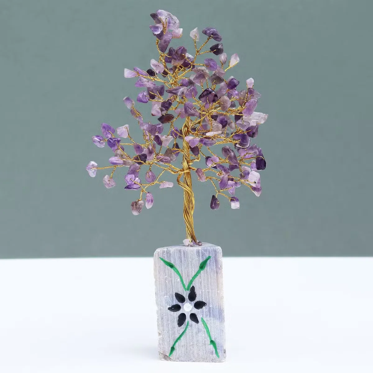 Amethyst stone displayed in a natural gemstone decor setting.
