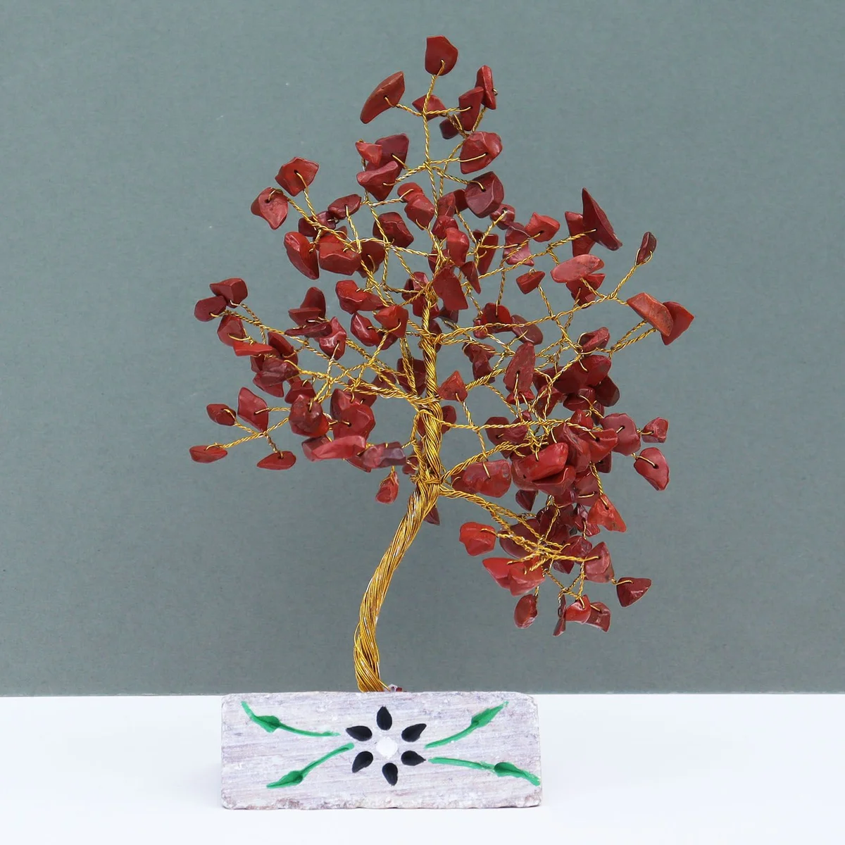 Smoothly finished red jasper stone, showing its rich red color and natural texture.