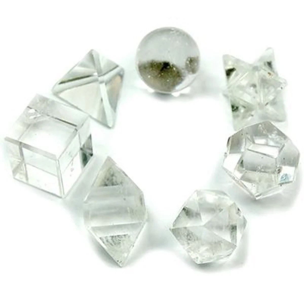 Seven geometric decor crystals arranged in a decorative crystal set