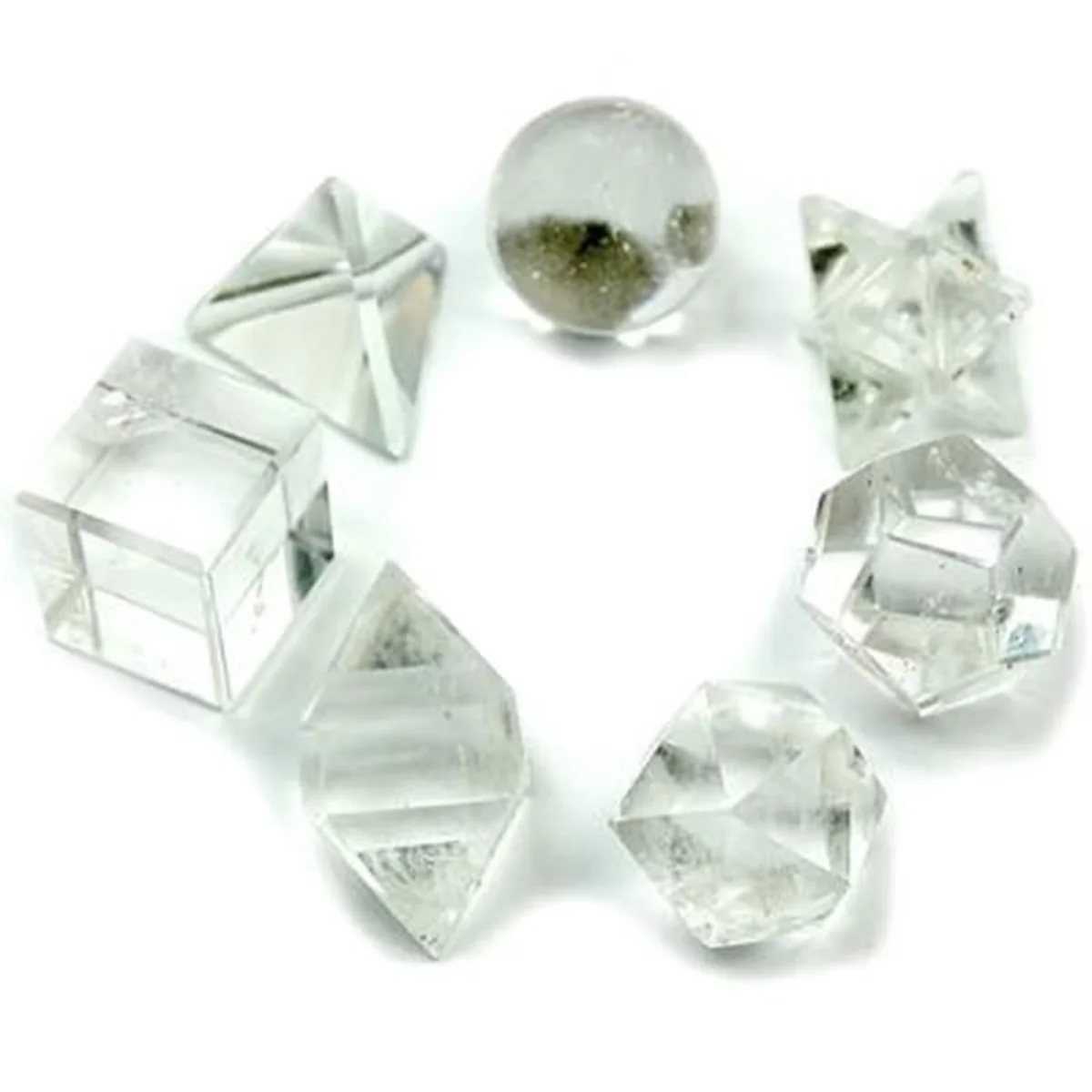 Seven-piece geometric crystal home ornaments set displayed in a clear crystal arrangement.