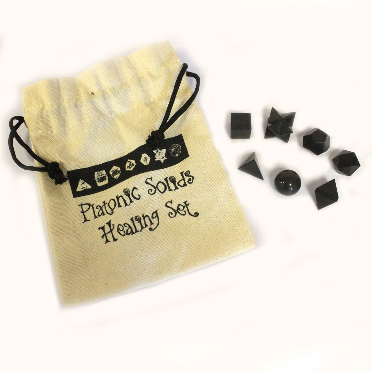 Seven piece black agate ornament set displayed on a flat surface