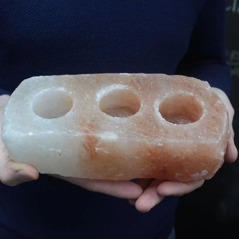 Natural salt candle holder with three openings, matte finish, simple design.