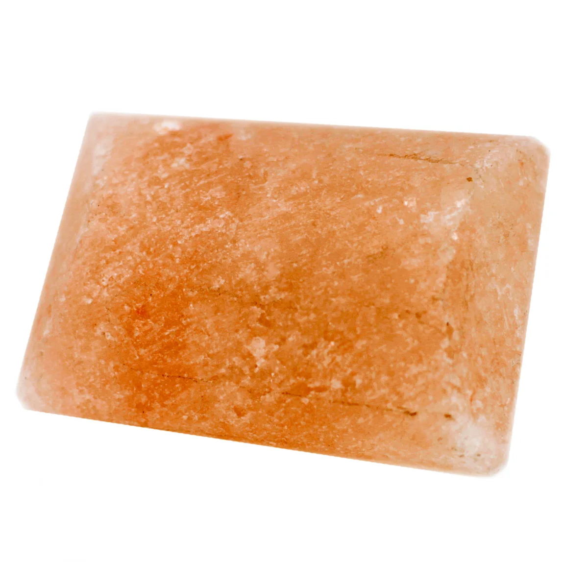 Bathroom deodorant bar shaped like a stone, displayed on a tile countertop