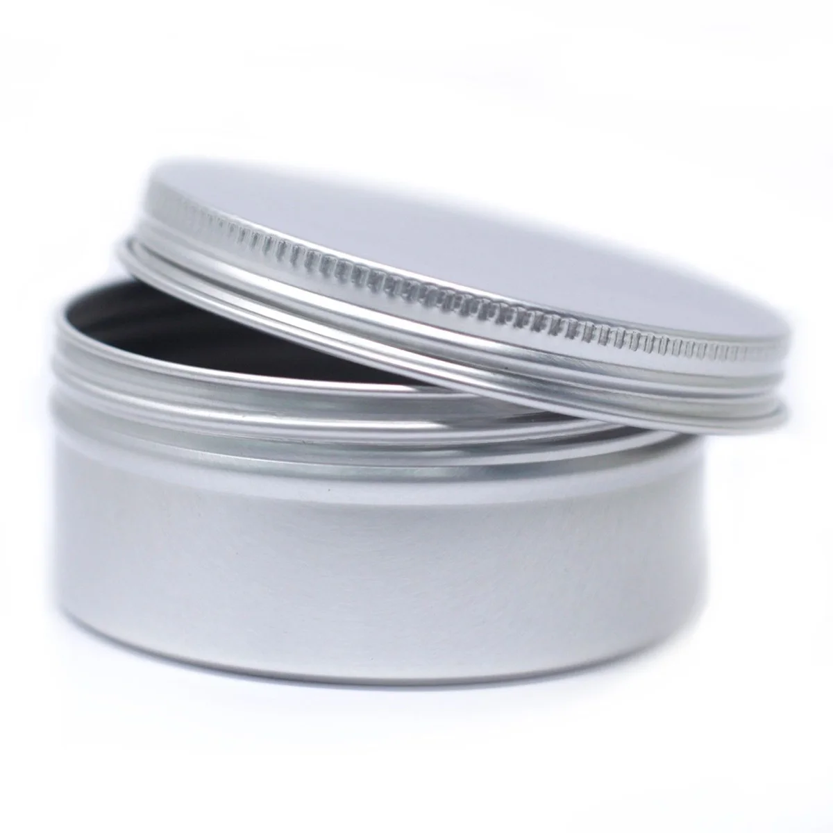 Round aluminium tin with screw top, 70x35mm, smooth polished metal finish.
