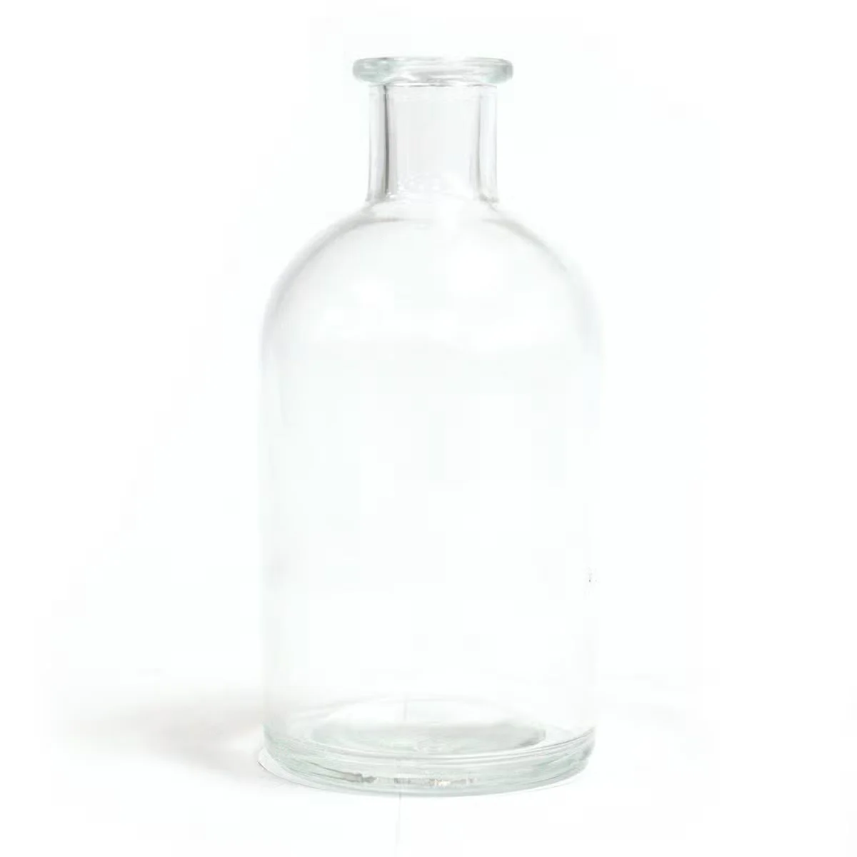 250 ml clear glass diffuser in a round antique bottle, clear glass reeds visible