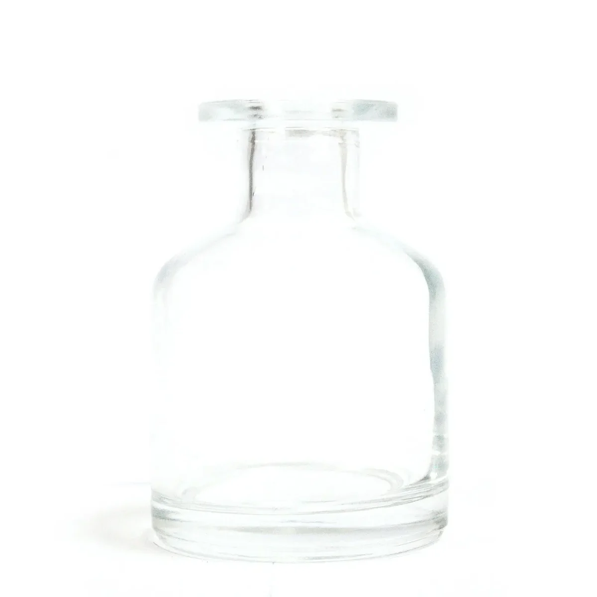 Clear 140 ml round diffuser bottle, Alchemist brand, streamlined glass design for a reed diffuser.