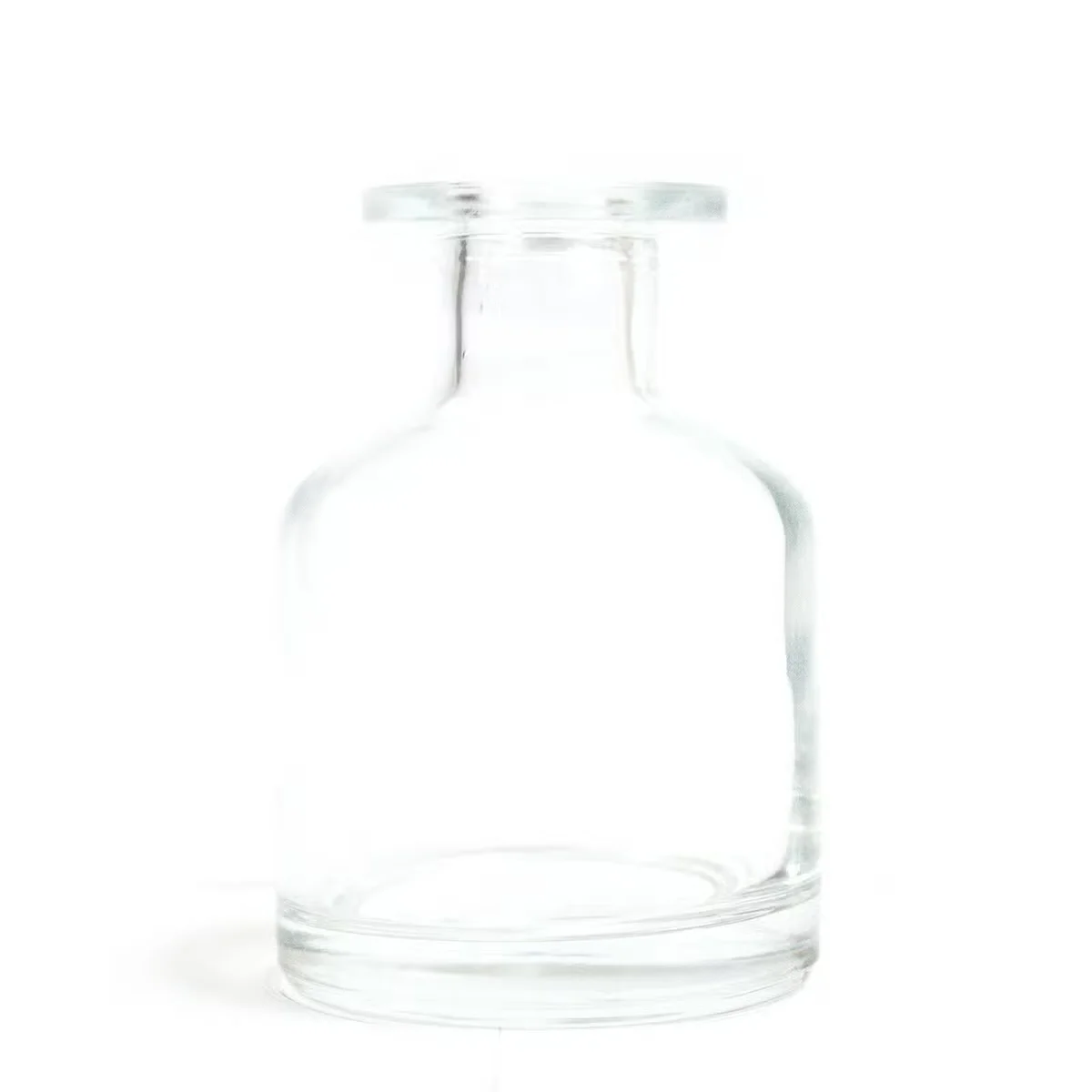 Clear 140 ml bottle, round shape, used for reed diffuser, with Alchemist branding