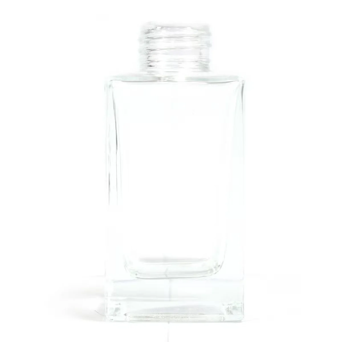 Clear square long 100 ml bottle of reed diffuser with standing reeds