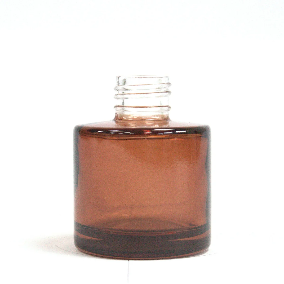 50 ml round amber diffuser bottle with a simple, smooth design suitable for reed diffusers on a white background