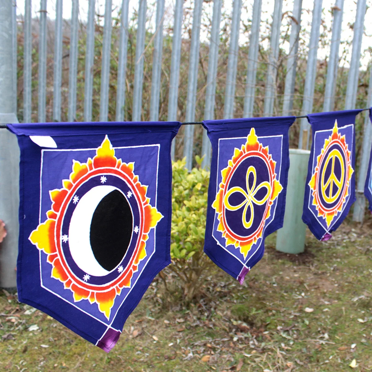Seven flags arranged in a love themed banner with the word Love in the center on a white background