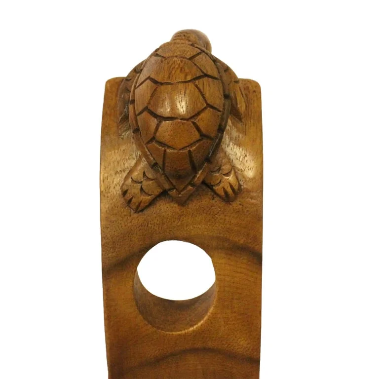 Decorative wine holder shaped like a turtle, displayed on a wooden surface.