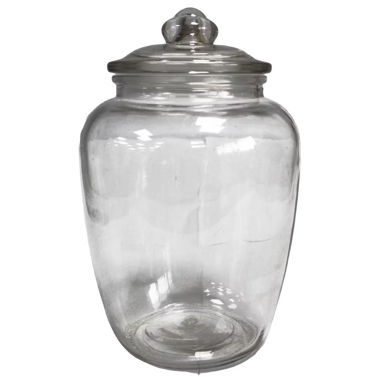 Big glass jar with sweet candies inside, classic style.