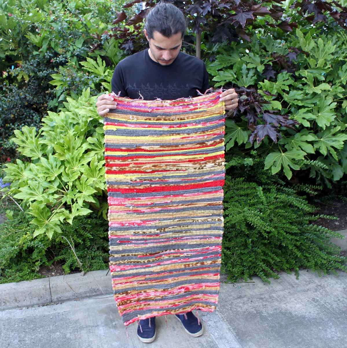 Small decorative velvet rug in deep color, measuring 50x90cm, displayed flat on a light background