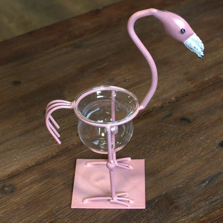 Pink metal flamingo plant stand for hydroponic home decor.