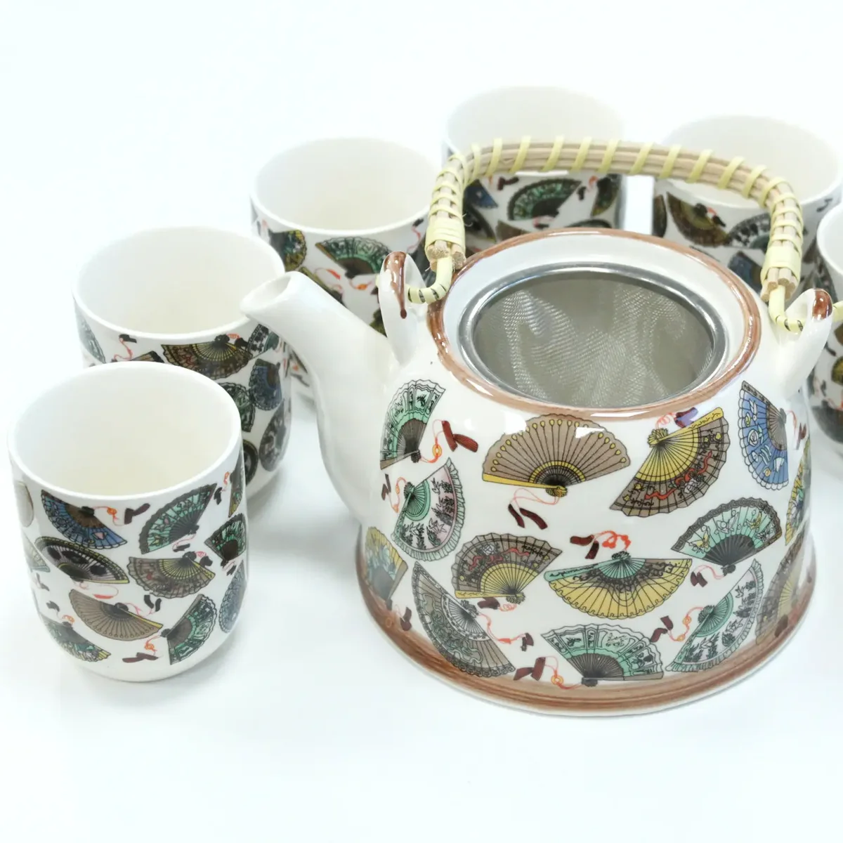 Elegant tea set featuring a china herbal teapot and matching cup.